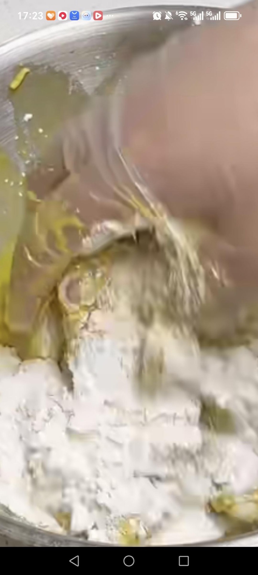 Pour off the milk from the marinated wings and pick out the solids, then add some of the coating mix and one egg to the wings.