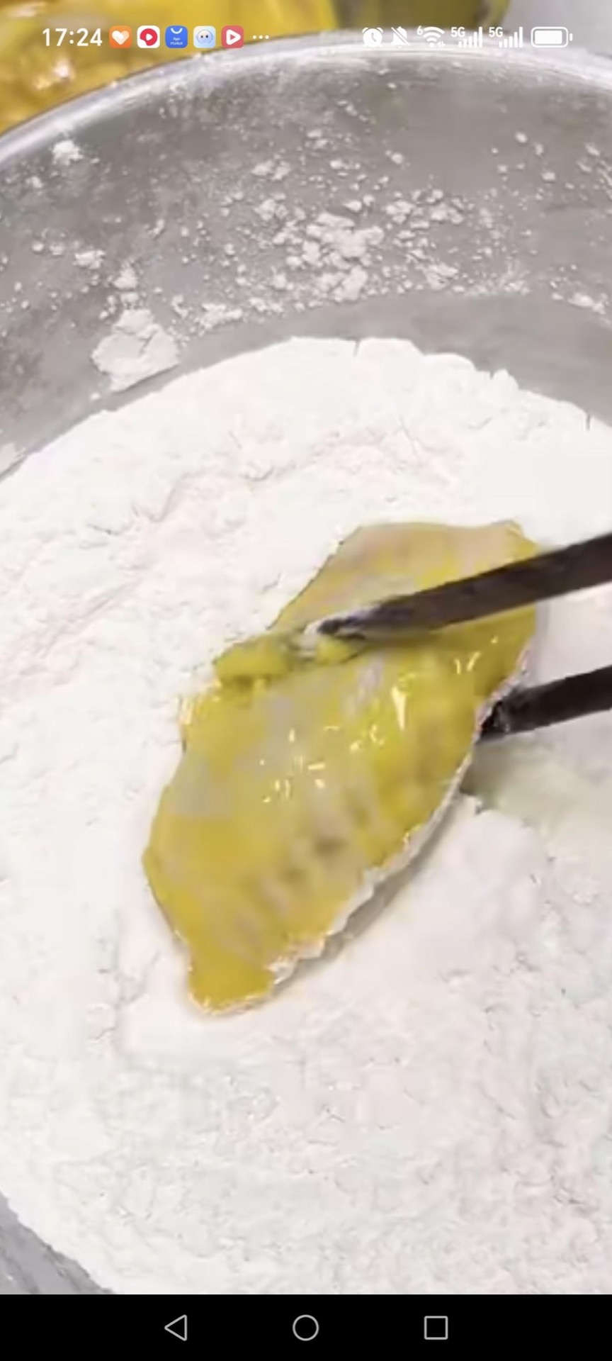 Roll each wing in the remaining coating mix until fully covered.