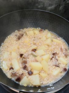Cover and simmer over low heat for at least 30 minutes, until the rice is tender and the water is fully absorbed.