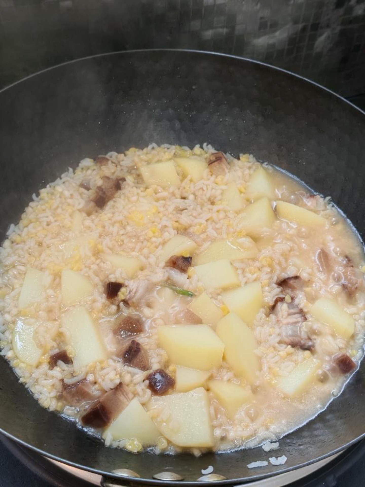 Cover and simmer over low heat for at least 30 minutes, until the rice is tender and the water is fully absorbed.