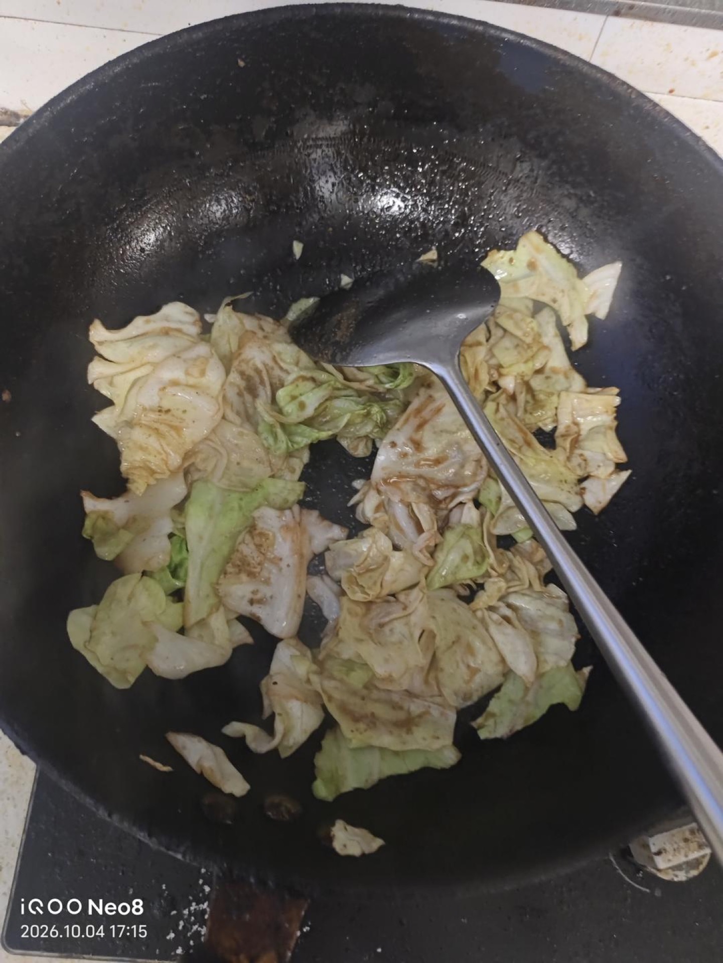 Once the wok is hot and the oil is hot, add the cabbage.