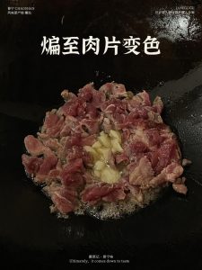 Keep stir-frying the pork until every slice has turned from pink to an even pale gold.