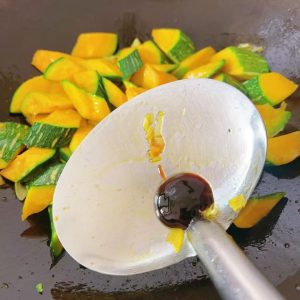 Add about half a spoon of oyster sauce and toss to build a savory base.