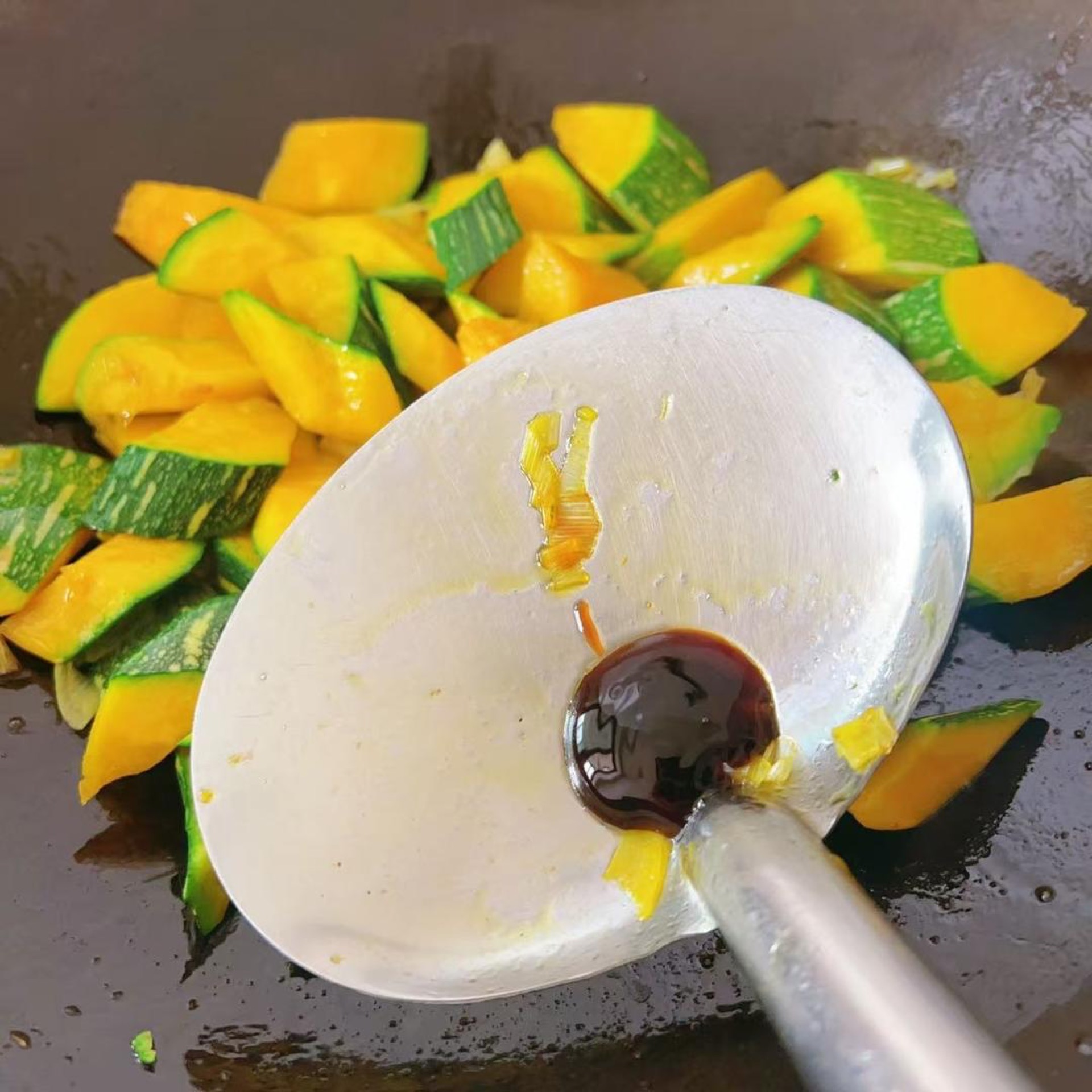 Add about half a spoon of oyster sauce and toss to build a savory base.