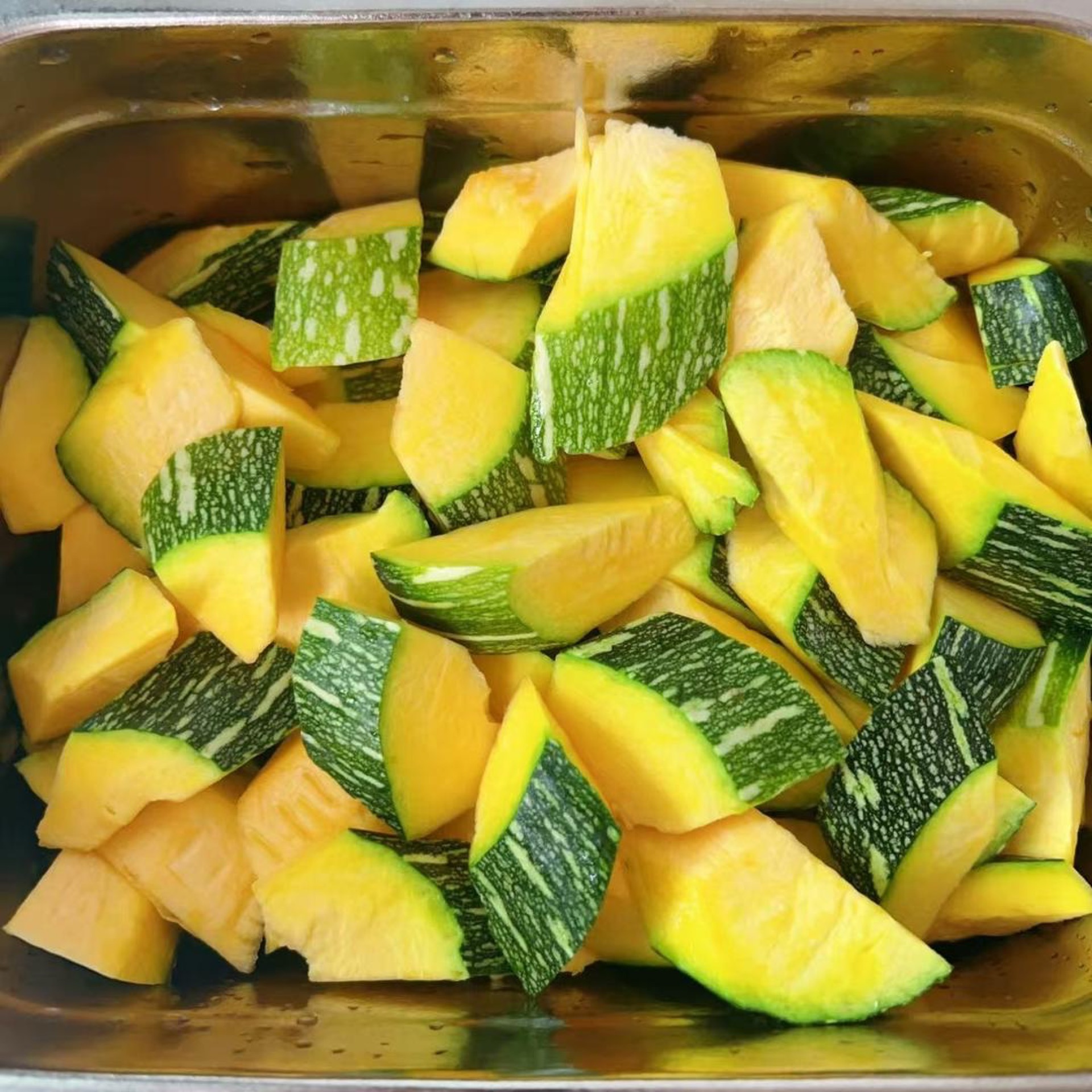 Scoop out the seeds and cut the young pumpkin into small, even chunks so it cooks through quickly.