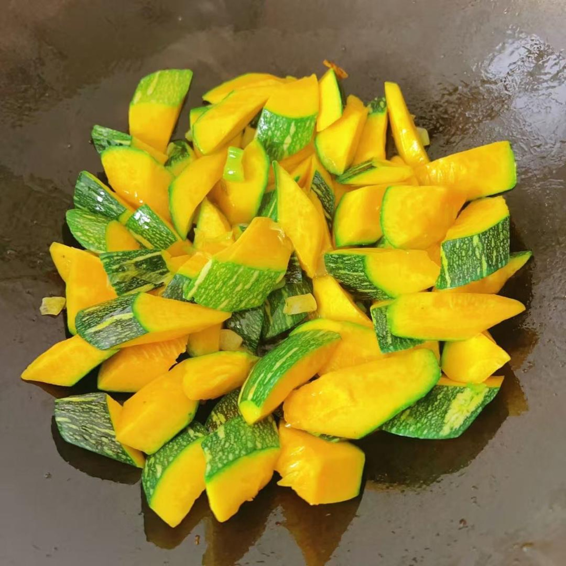 Add the young pumpkin and stir-fry over high heat.