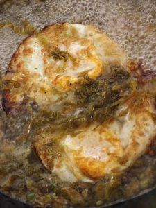 Next, drop the fried eggs into the broth and let them bubble for a while, so they soak up the sour, savory soup like sponges.