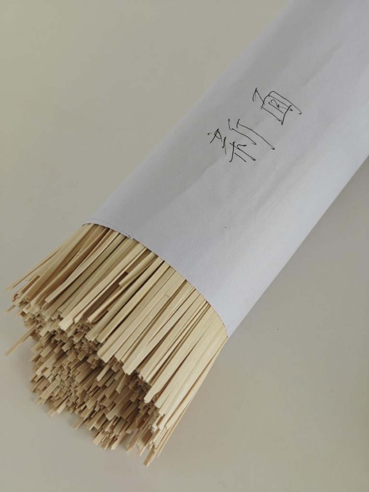 Once the water comes back to a boil, add the bundle of fresh handmade noodles.
