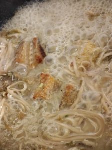 Taste the broth and add a little salt as needed, going easy since the pickled cabbage is already salty, then stir in the white pepper.