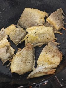 Do not move the fish around; wait until one side is golden and firm before turning it over.