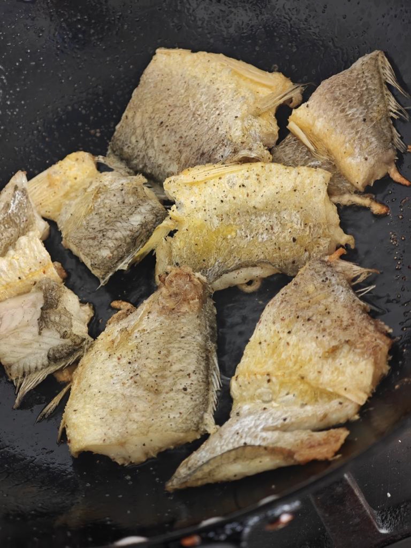 Do not move the fish around; wait until one side is golden and firm before turning it over.