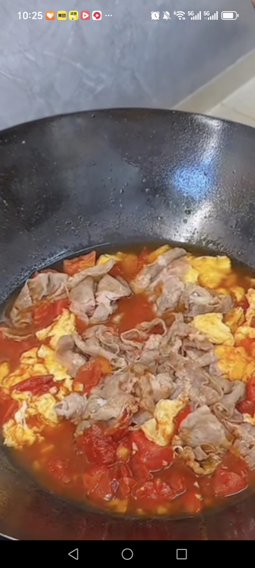 Slide the blanched beef into the wok and pour in the hot water so everything is just barely covered.