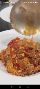 Spoon hot rice into bowls, ladle the tomato beef and egg over the top, and serve right away.