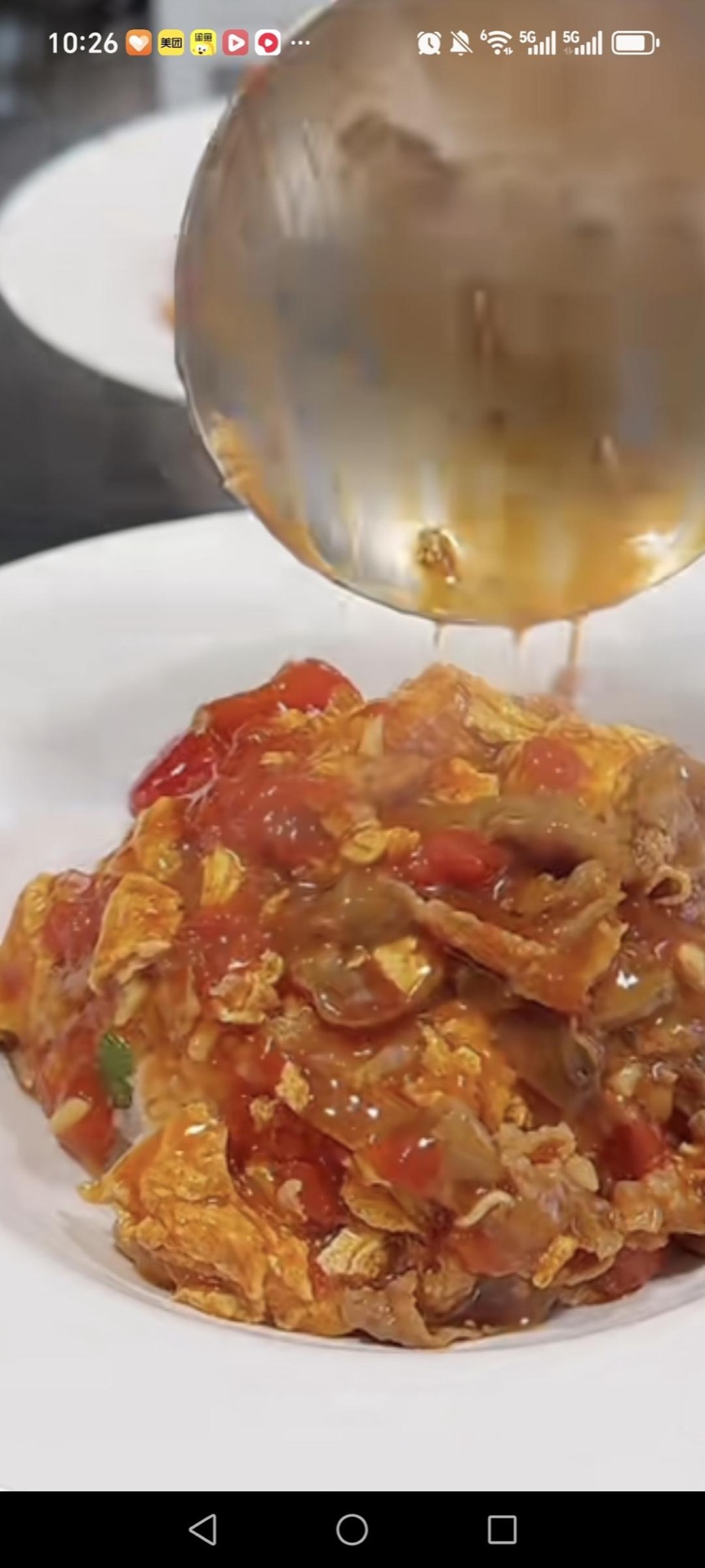 Spoon hot rice into bowls, ladle the tomato beef and egg over the top, and serve right away.