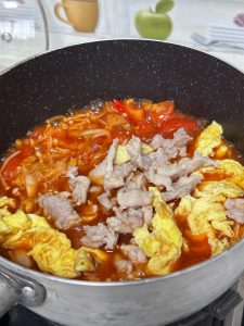Finally, add the pork slices back in and simmer for 1 minute.